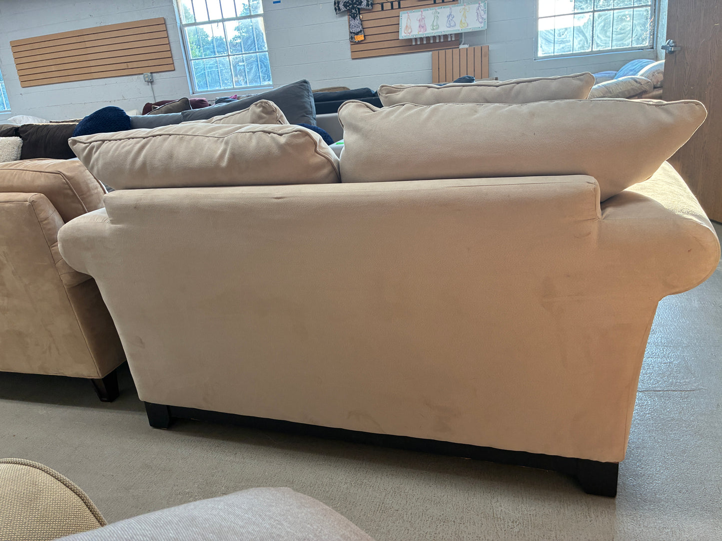 Cream Upholstered Loveseat with Accent Pillows