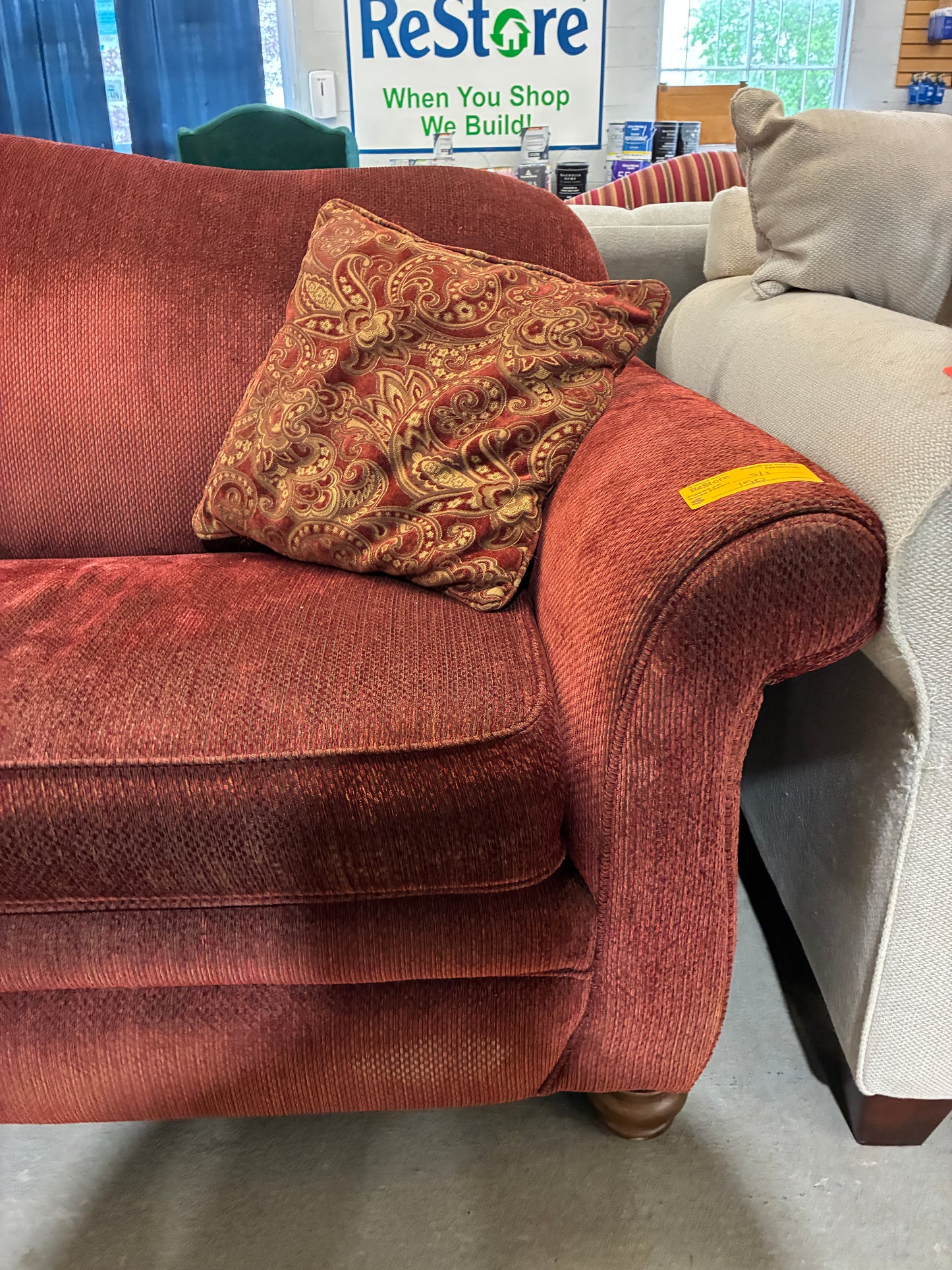 Red Upholstered Sofa with Accent Pillows