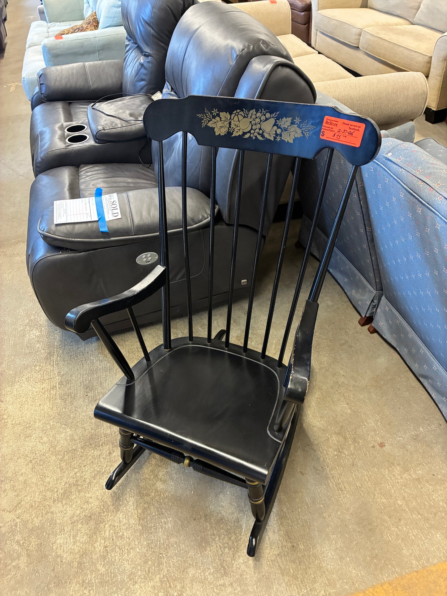 Black Wooden Rocking Chair with Decorative Back Detail