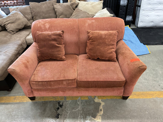 Light Red Textured Loveseat with Throw Pillows