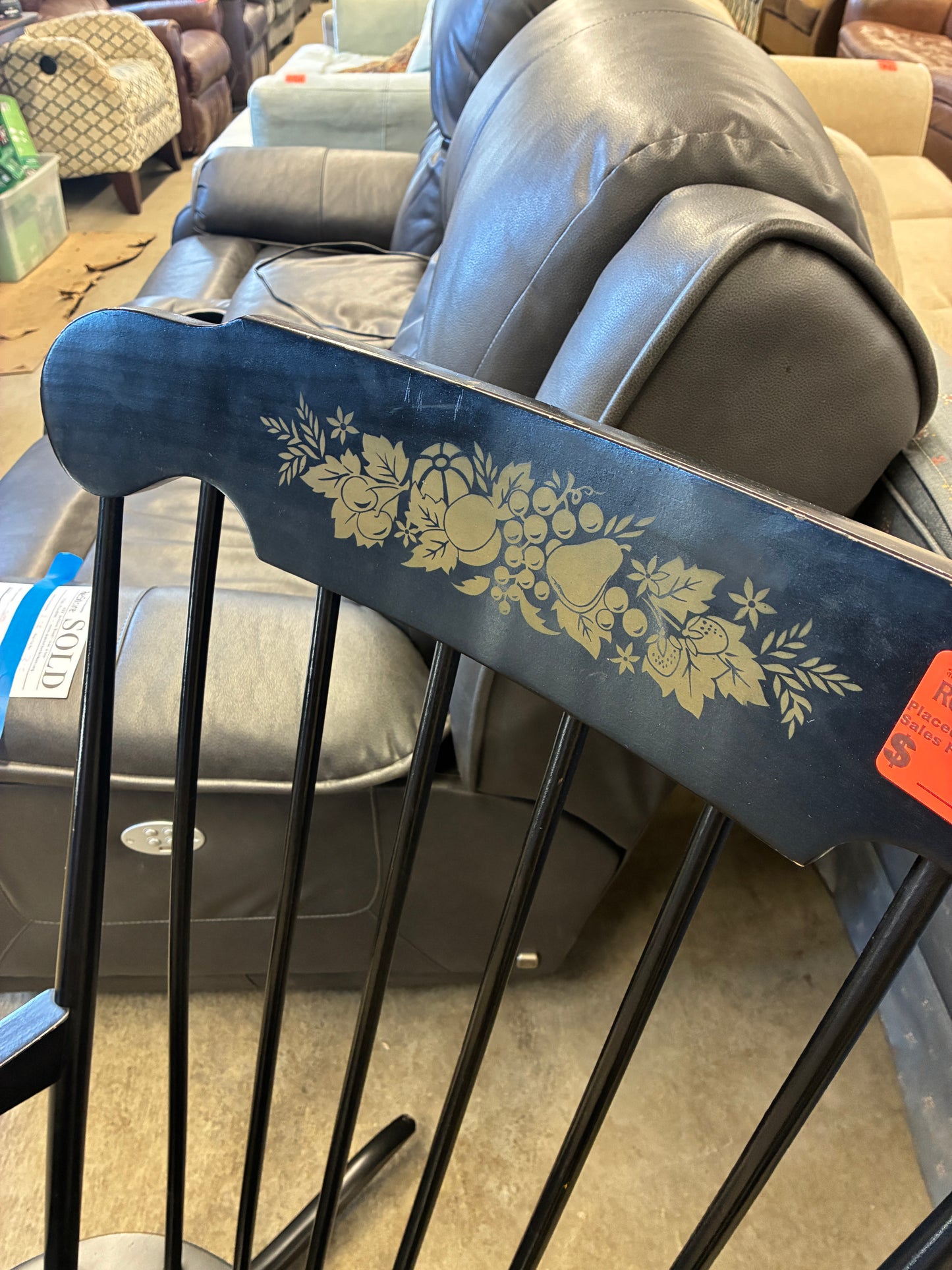 Black Wooden Rocking Chair with Decorative Back Detail