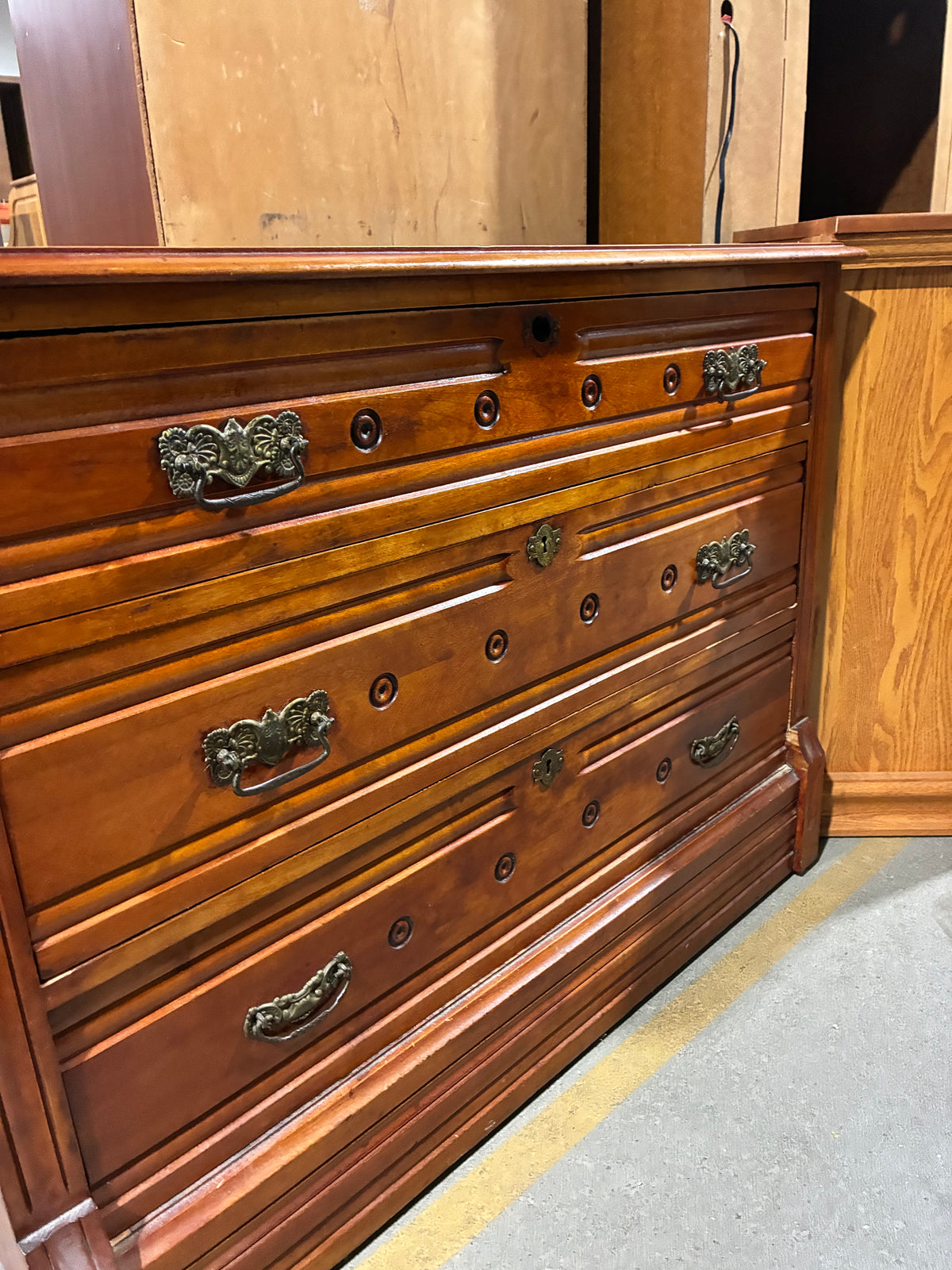 Vintage Three-Drawer Wood Dresser with Ornate Hardware