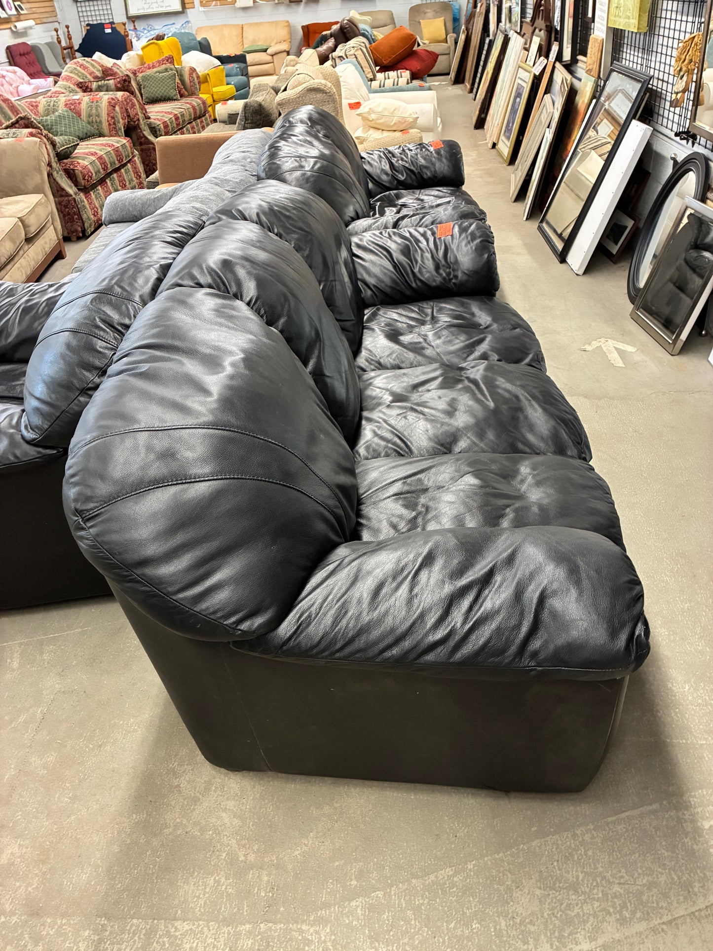 Black Leather Sofa with Plush Cushioning