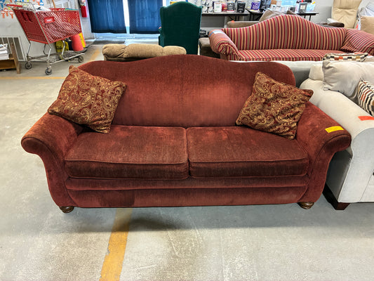 Red Upholstered Sofa with Accent Pillows