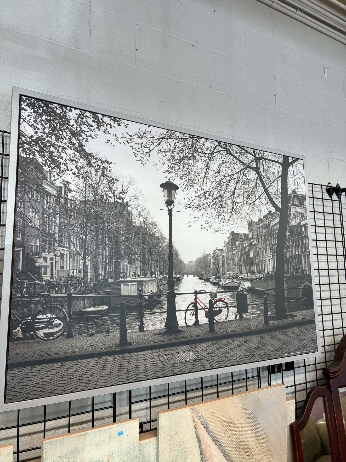 Framed Black and White Canal Wall Art with Red Bicycle Accent