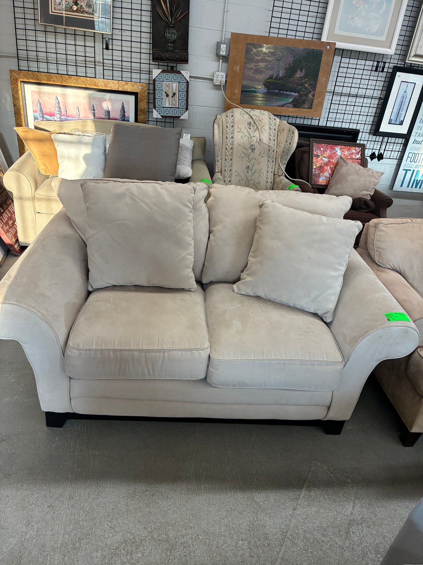 Cream Upholstered Loveseat with Accent Pillows