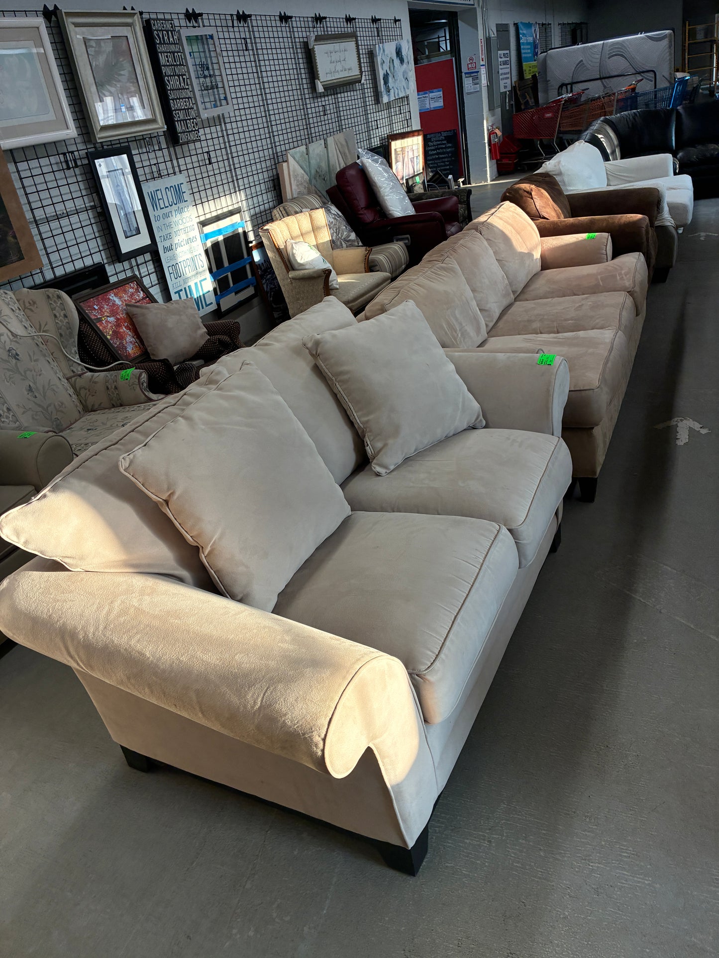 Cream Upholstered Loveseat with Accent Pillows
