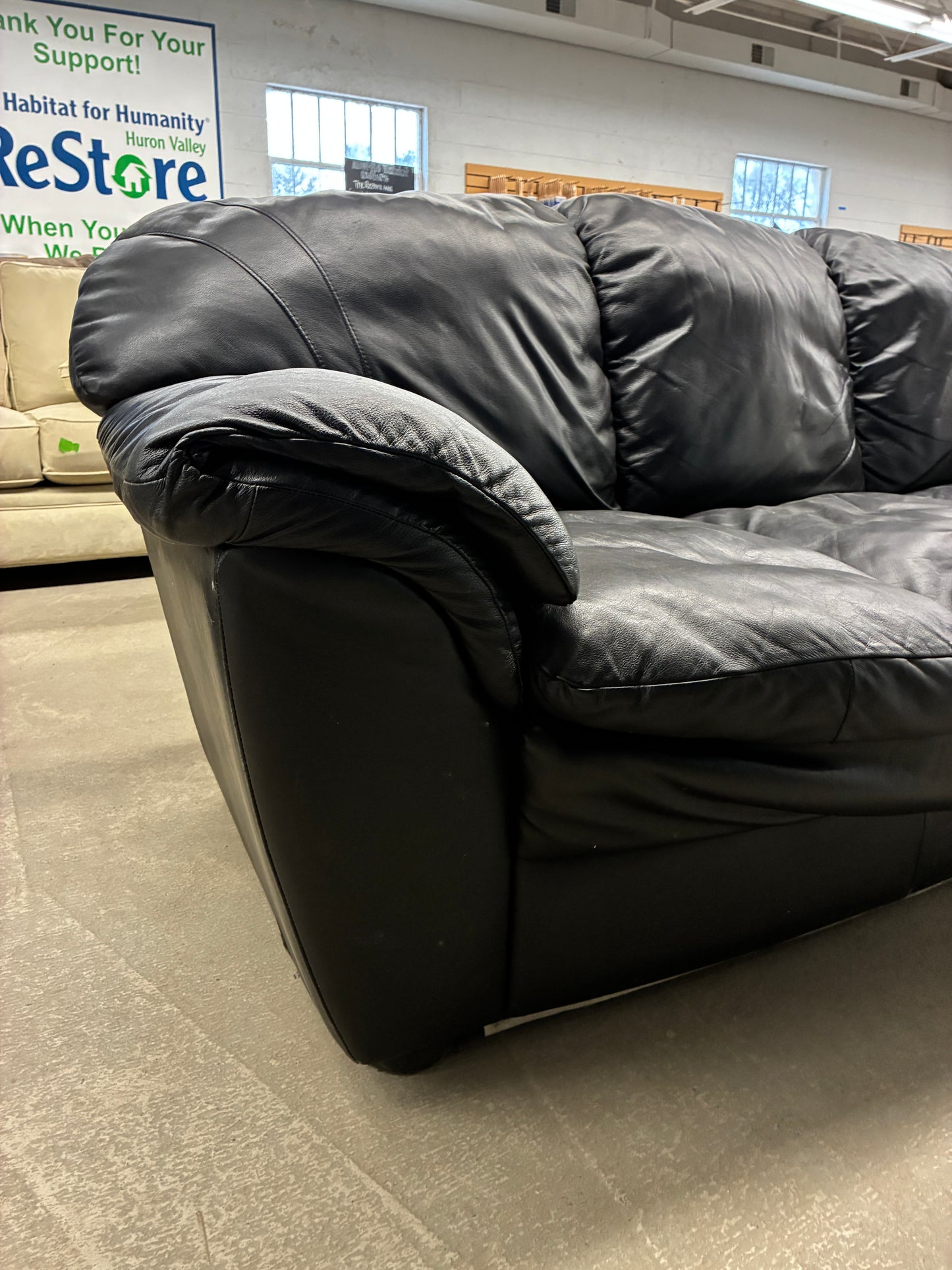 Black Leather Sofa with Plush Cushioning