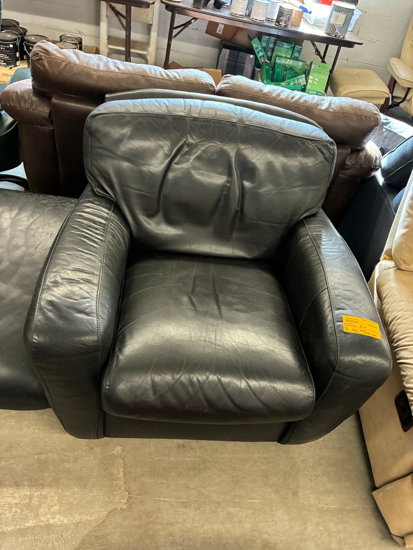 Black Leather Lounge Chair with Rolling Ottoman