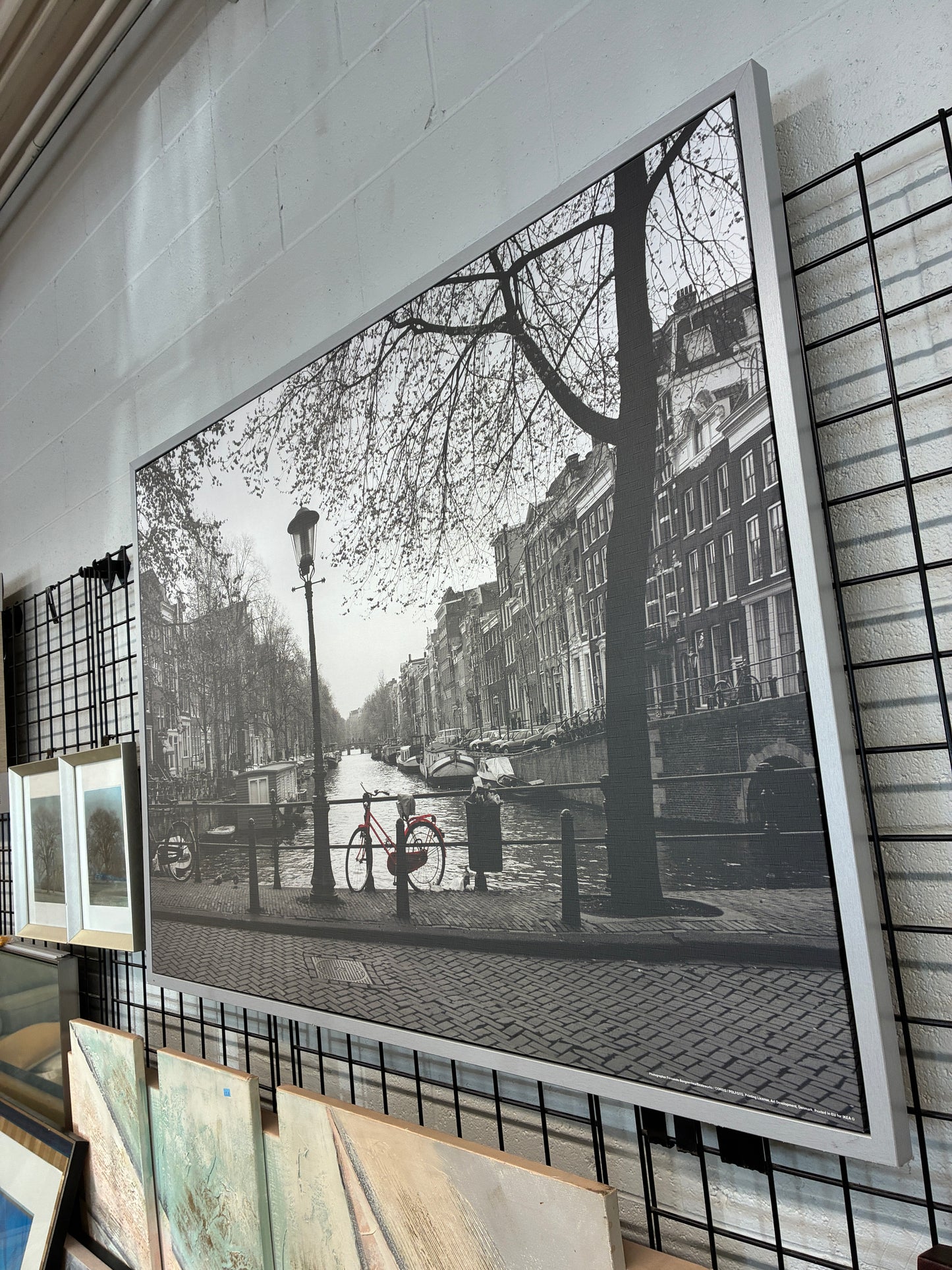 Framed Black and White Canal Wall Art with Red Bicycle Accent
